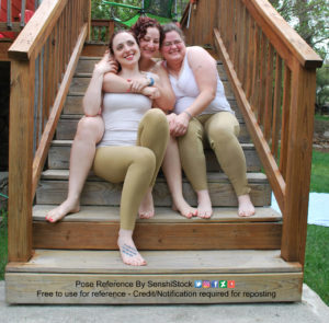 A group of various sized white women are sitting next to each other on a set of stairs, all huddled up really close, and smiling.