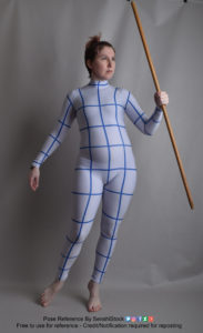 Thin white woman wearing a form-fitting zentai suit (full body outfit with lines to help with perspective), standing with one leg back and foot slightly raised, holding a bo staff in one hand raised up as she looks off into the distance.