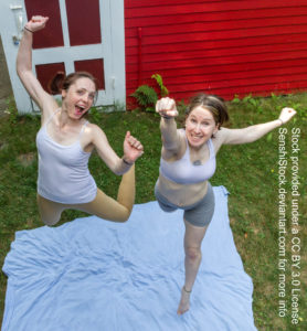 Two thin white women seen from a bird's eye view jumping toward the camera in an excited leap.