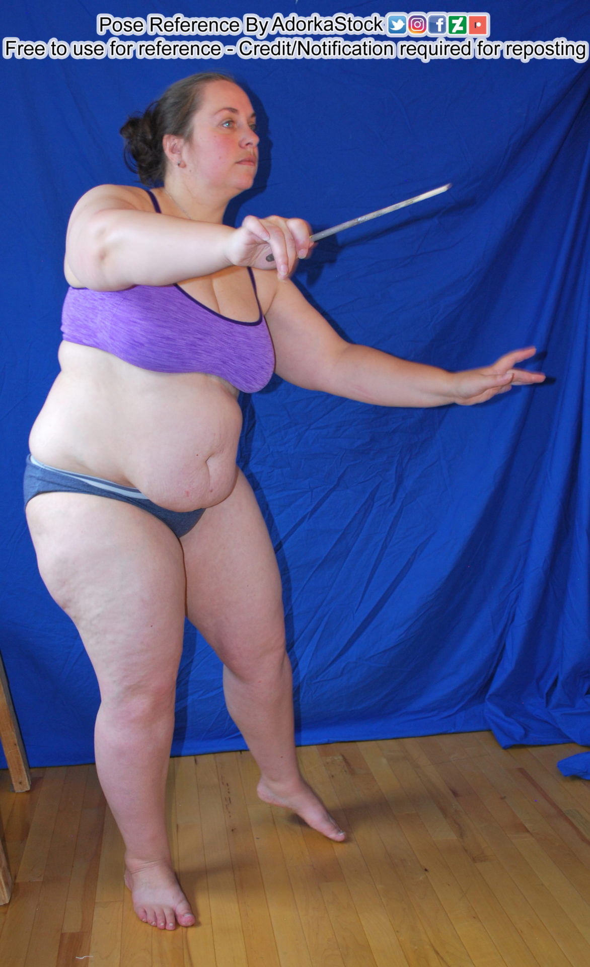 fat, white, female pose reference model with a wand as if conducting music or casting a spell