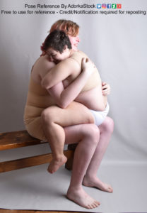 Two pose reference models, one really tall and one really short. The short model is sitting in the lap of the tall model, facing them, hugging.