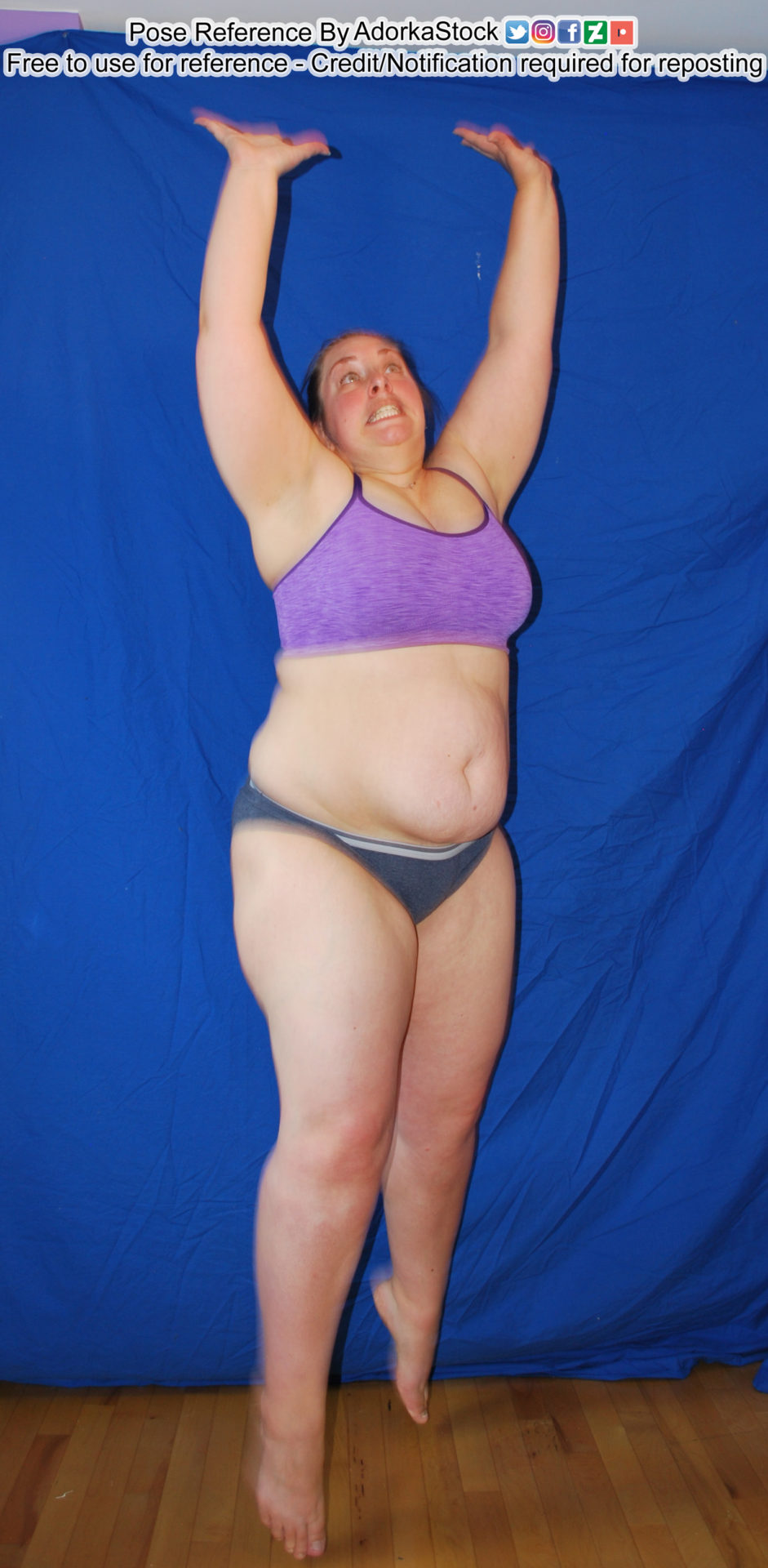 fat, female, white pose reference model jumping with both hands stretched over head and toes pointed