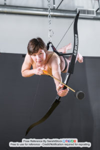 thin, female, white pose reference model shooting a bow and arrow while flying in perspective