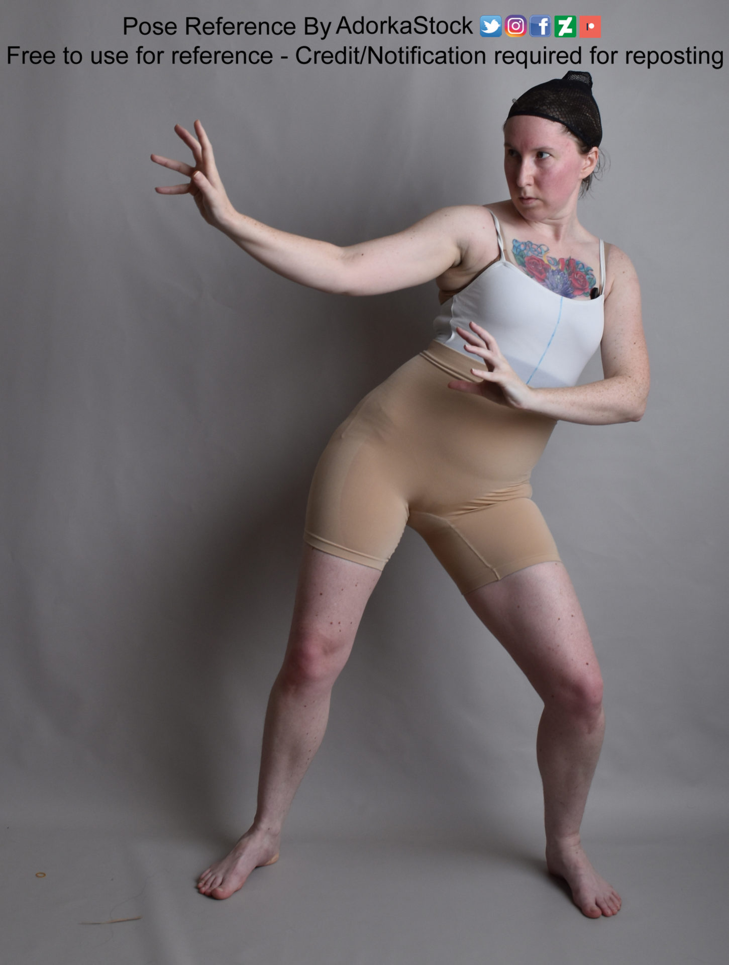 thin, white, female pose reference model in a slight lunge with arms gesturing to the side as if casting magic