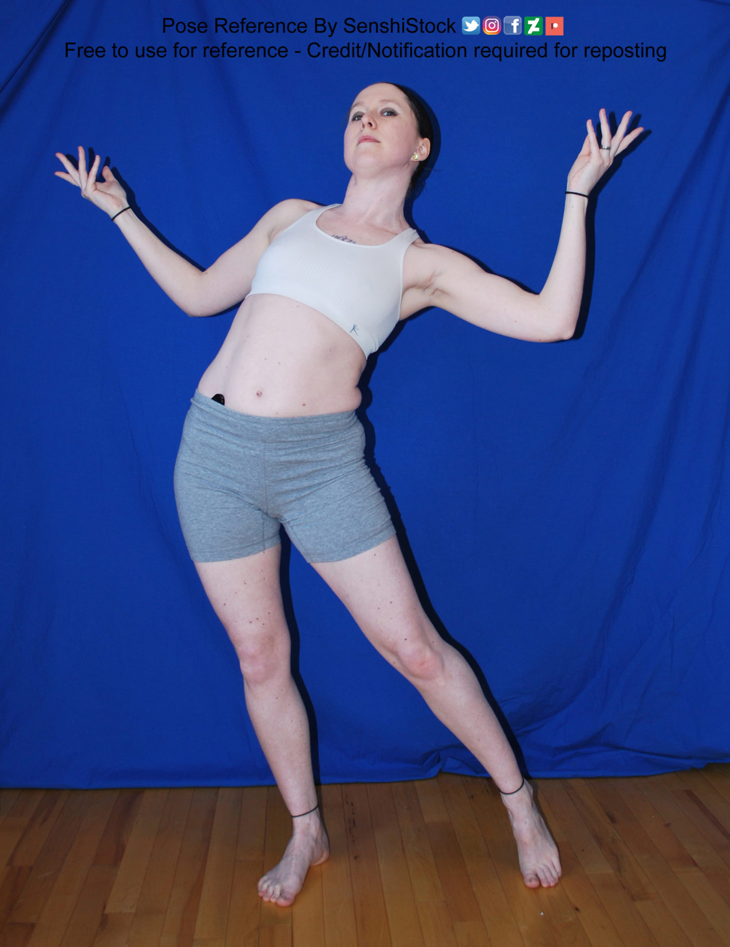 Thin, white female pose reference model in a dynamic, open arm gesture with weight shifted heavily to one foot