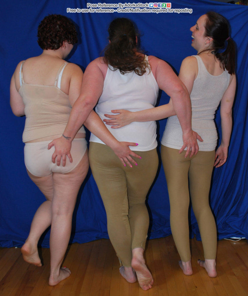 Three people grabbing each others’ butts