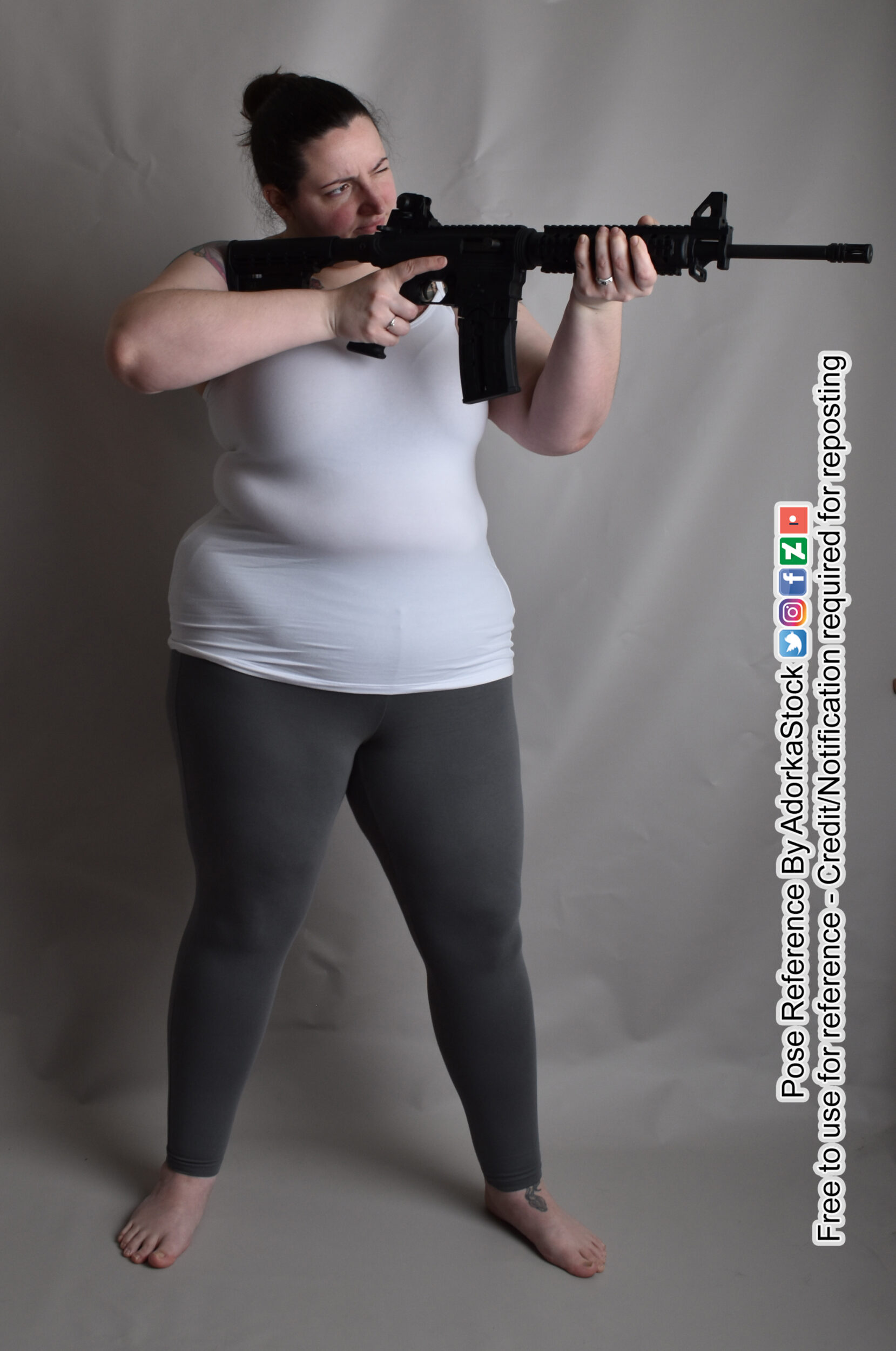 Fat female pose reference model holding a rifle
