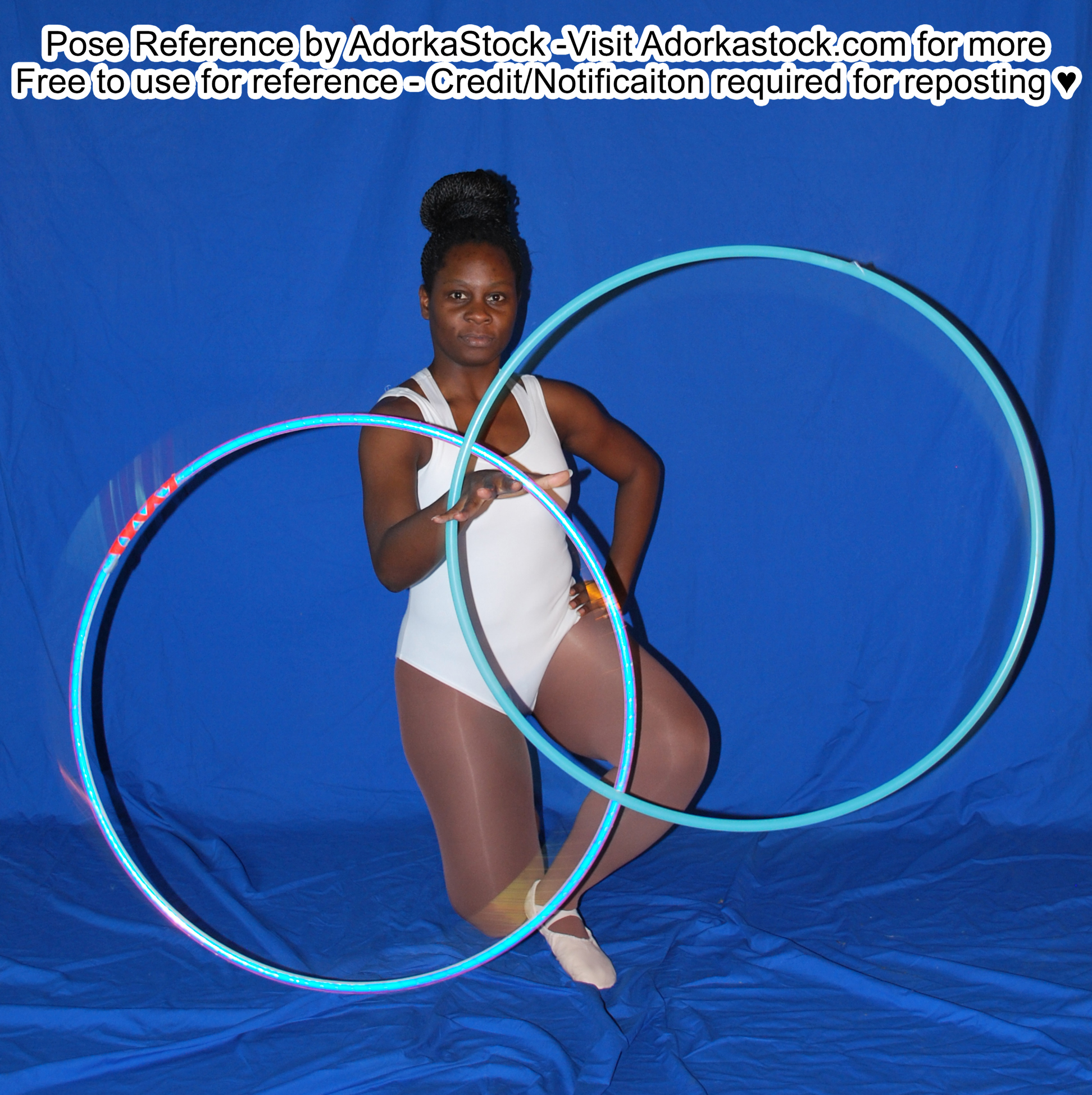 Thin, Black, female pose reference model in kneeling pose with one hand outstretched, two hoops spinning around her wrists.