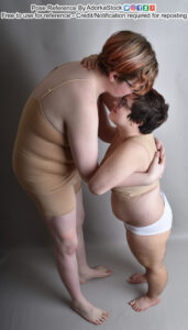 Two pose reference models, one very tall and the other very short in high perspective standing pose with the tall model bending down to kiss the forehead of the other.