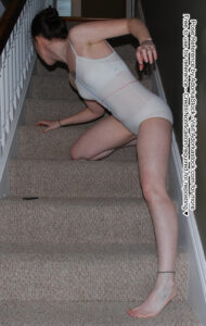 Thin, white, female pose reference model in crawling pose with stairs, slightly turned away with dynamic arms.