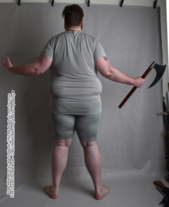 A fat white man standing, back facing the camera, holding an ax in his right hand.