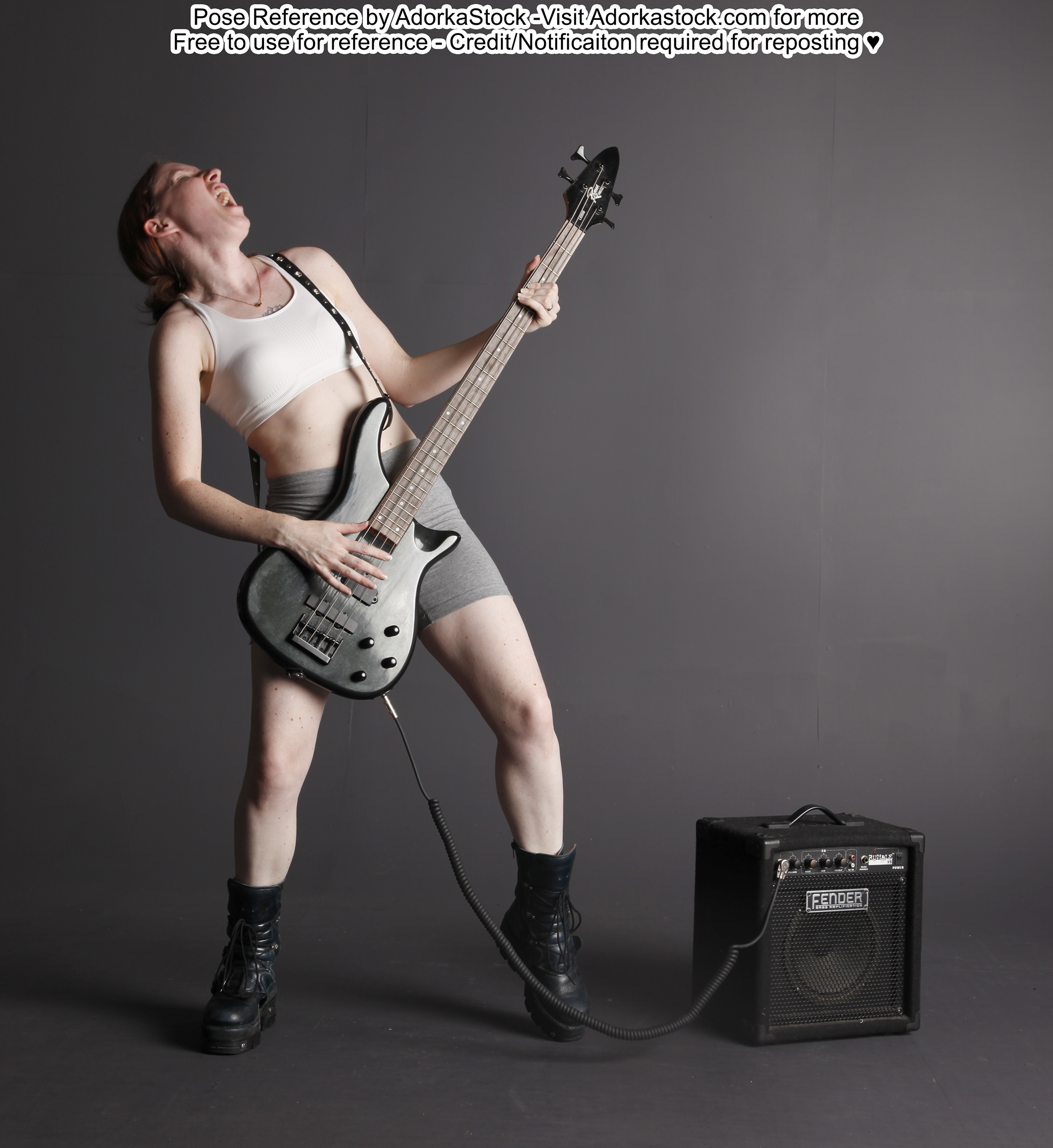Woman playing bass guitar pose reference rocking out with head back yelling