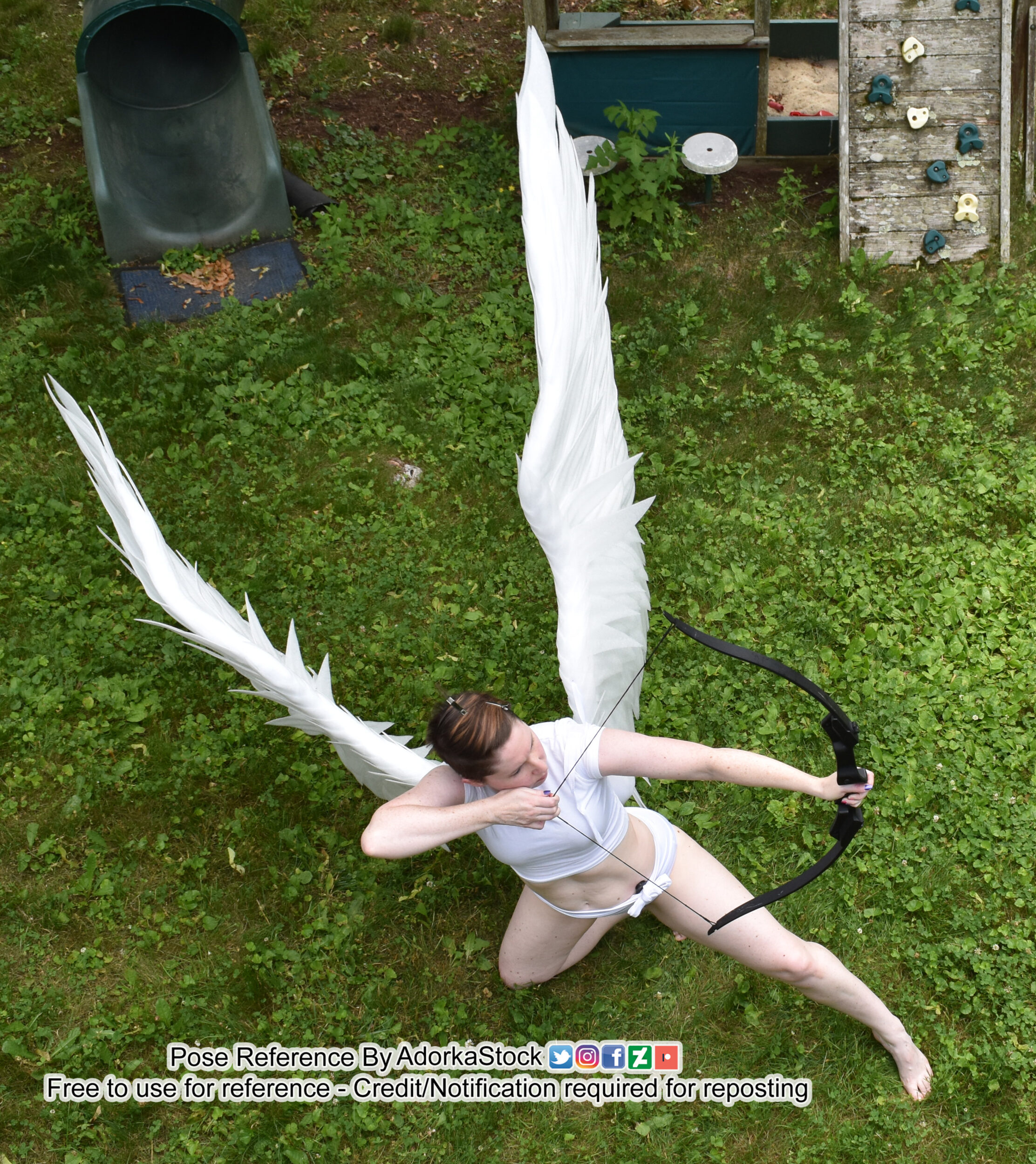 Thin, white, female pose reference model in kneeling pose with very large wings, shooting a bow and arrow while in a kneeling lunge.