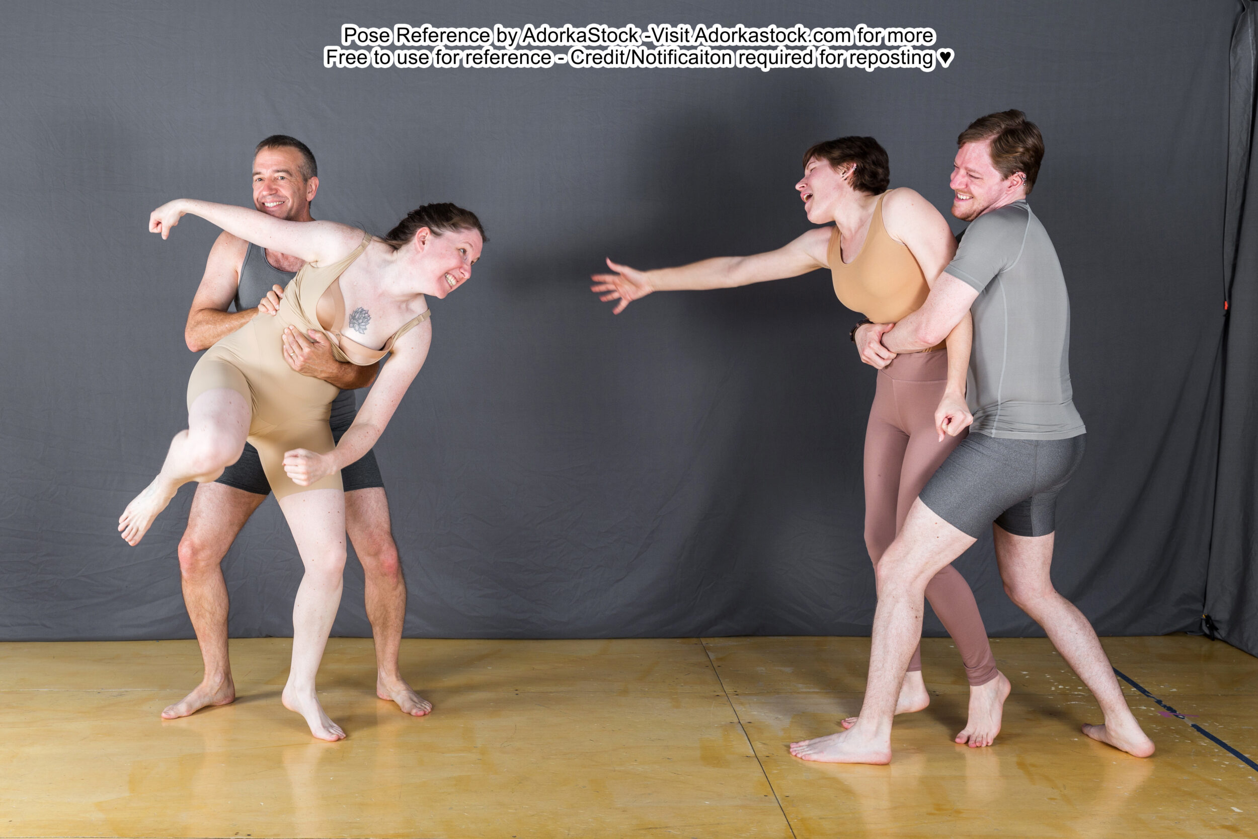 Group pose reference where two models are holding two others from getting at each other.
