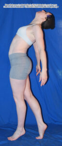 thin, white, female pose reference model in profile standing pose with one foot back, arms hanging loose, face to the sky, back arched