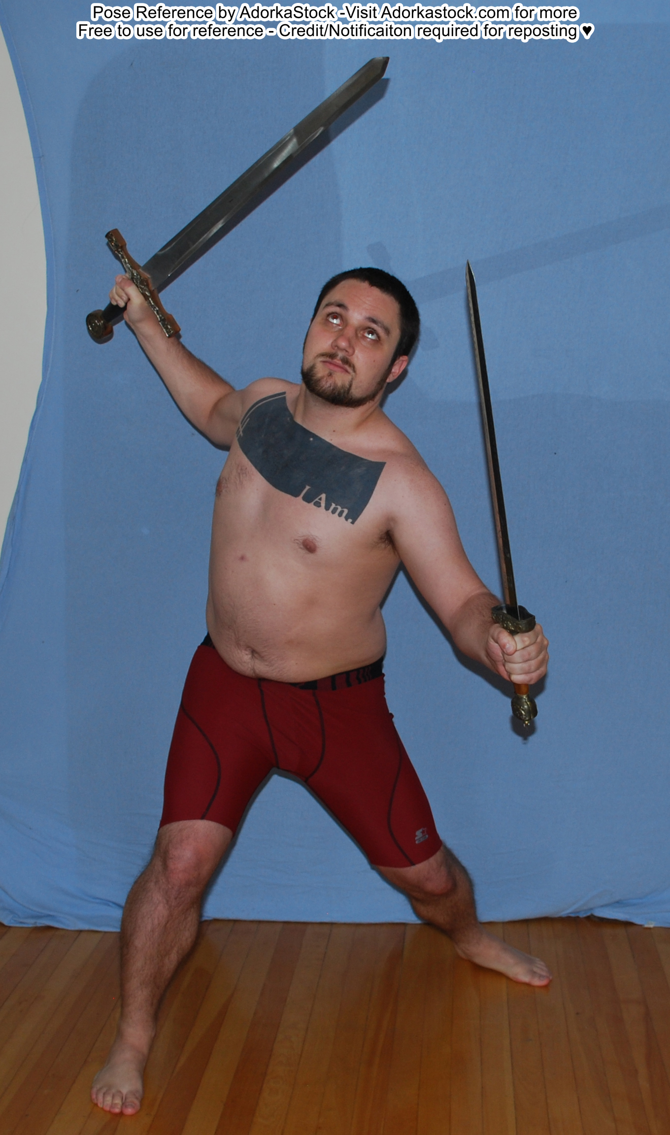 fit, white, male pose reference model in standing pose with two swords up and out