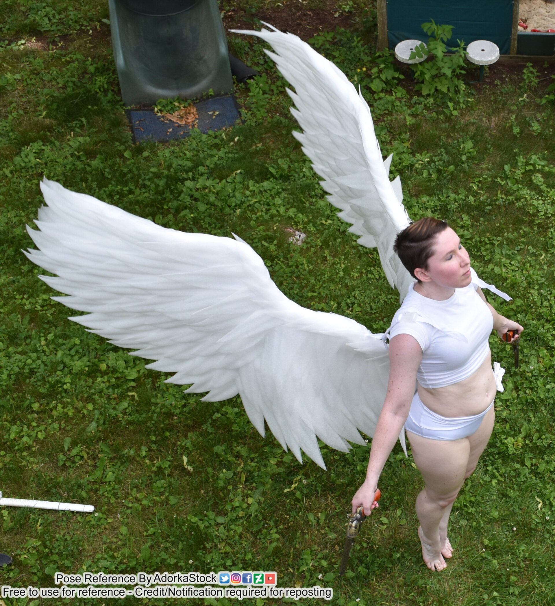 thin, white, female pose reference model in high perspective standing pose with huge wings, arms to her side, on tip toes
