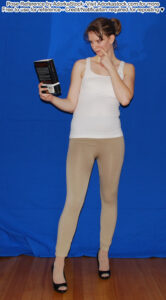 thin, white, female pose reference model in standing high heel pose with a book