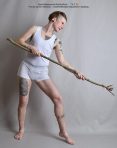 thin, nonbinary pose refrence model in standing pose with a long staff aimed low