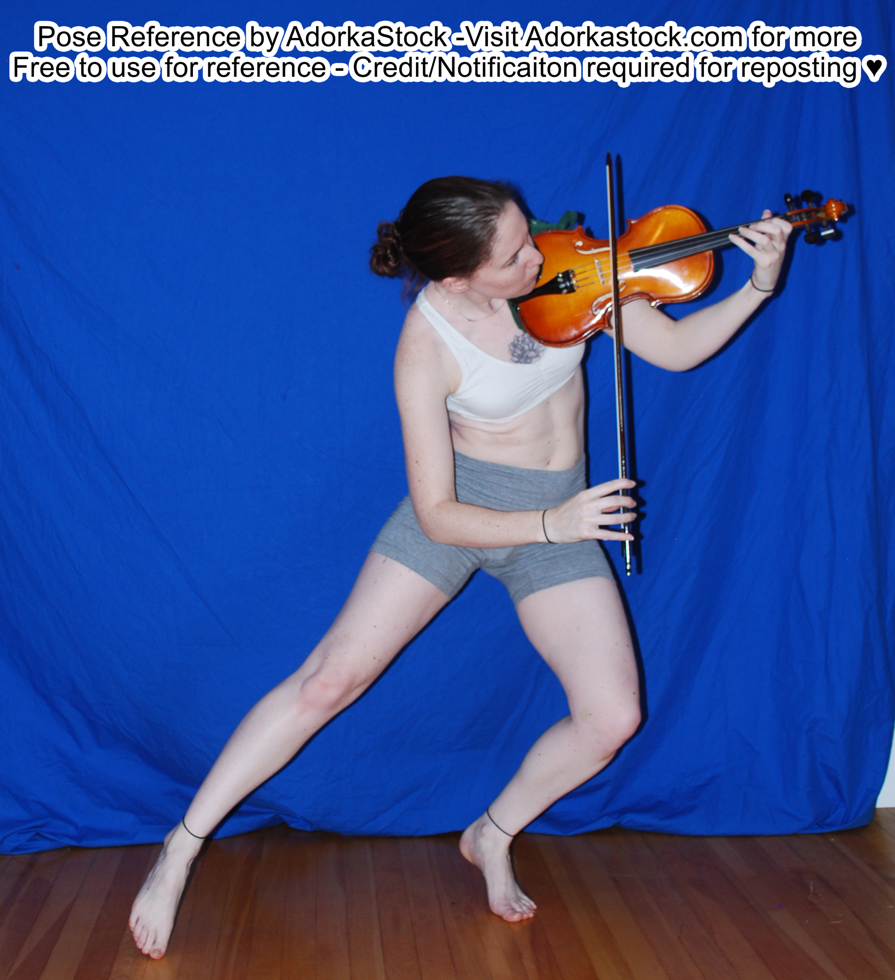 Thin, white, female pose reference model in lunge pose with a viola.