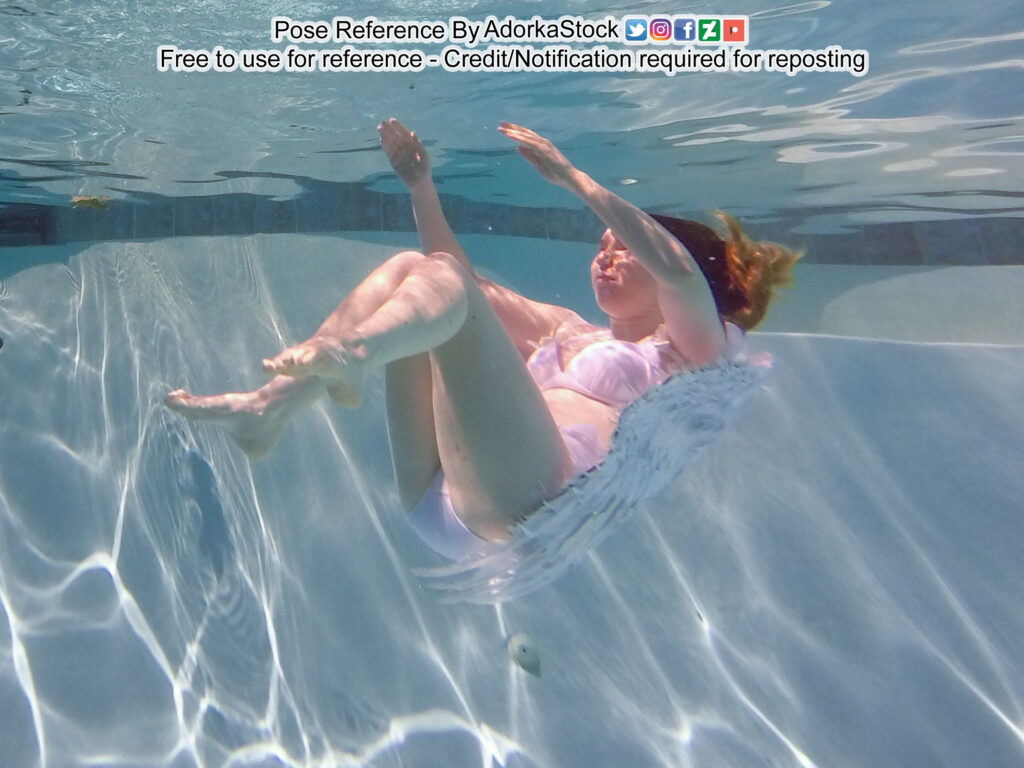 thin, white, female pose reference model in underwater pose with arms and legs raised, wings behind her