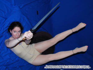 thin, white, female pose reference model in dynamic falling pose with a sword
