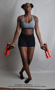 Pose reference model taking a step forward with a Nerf gun in each hand