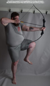 Fat, white, pose reference model standing on one foot, other foot raised, archery bow drawn back to fire