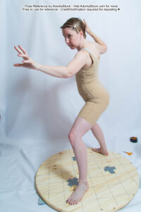 thin white female pose reference model in dynamic reaching magic pose