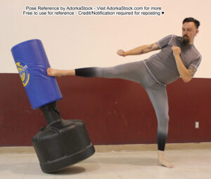 Tall male model kicking