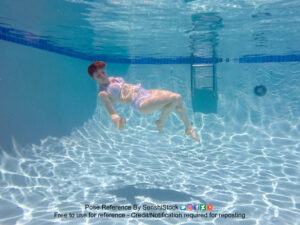 thin white female model underwater floating