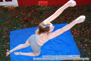 thin white female pose reference model in an airborne pose from a high perspective as if hanging from something