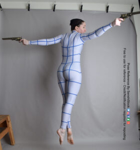 thin white female pose reference model in a grid suit jumping 3/4 back pose with arms out to each side firing revolvers