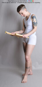 thin nonbinary model holding a rolled open scroll