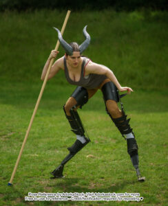 pose reference model standing in digitigrade legs, wearing horns, and holding a large staff