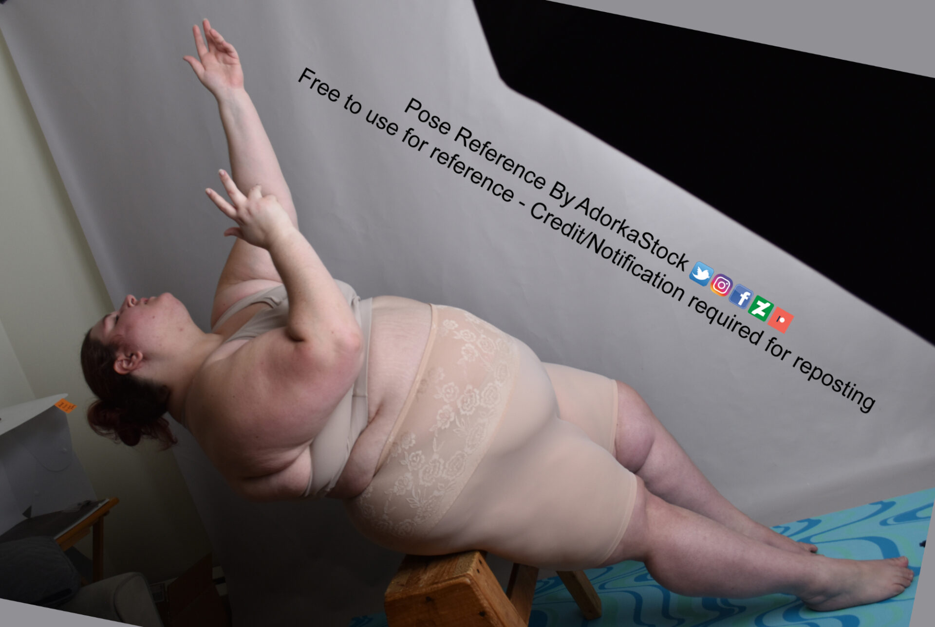 Fat white female model reclined, reaching upward
