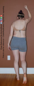 back facing pose reference with one fist up against the wall