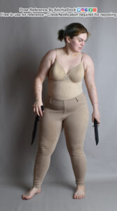 pose reference model standing with two blades in hand in a fairly neutral standing pose